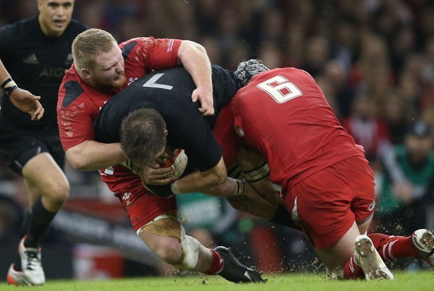 New Zealand All Blacks Richie McCaw is tackled by WalesÕs Samson Lee and Dan Lydiate 22/11//2014