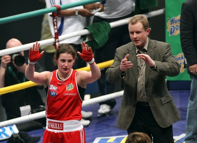 Katie Taylor (RED) celebrates winning her fight