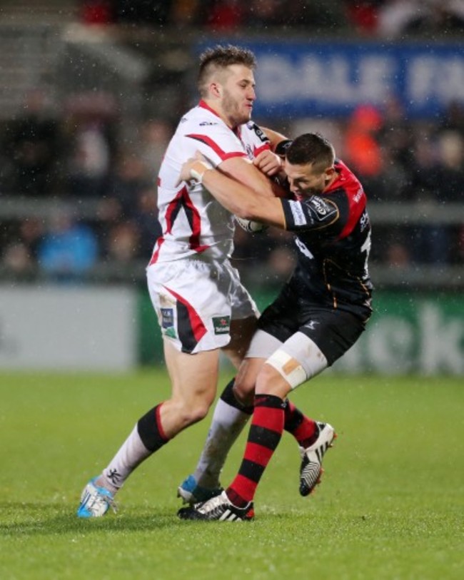 Stuart McCloskey is tackled by Jason Tovey