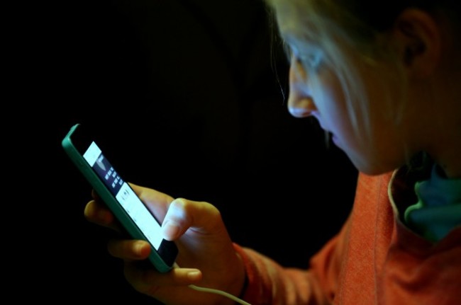 Teenager using mobile phone stock