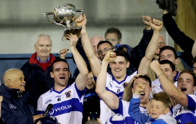 Ger Brennan and Diarmuid Connolly lift the trophy
