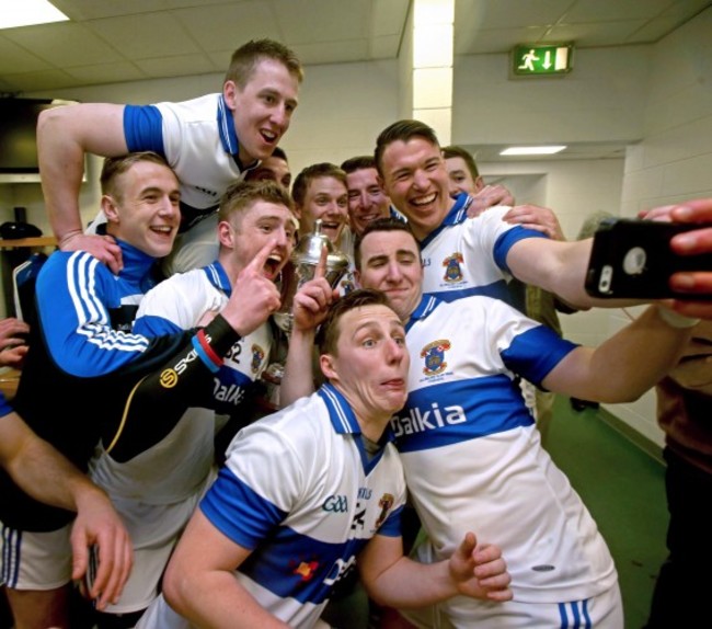 The Vincent's team celebrate in the dressing room after the game