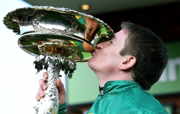 Barry Geraghty kisses The Stan James Champion Hurdle Challenge Trophy after winning on Jezki 11/3/2014
