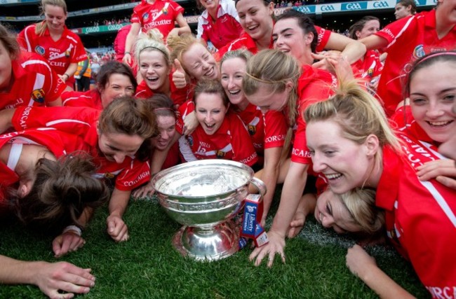 Cork players celebrate with The O'Duffy Cup