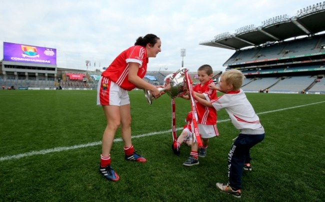 Geraldine OÕFlynn wrestles back The Brendan Martin Cup after two young fans ran off with it