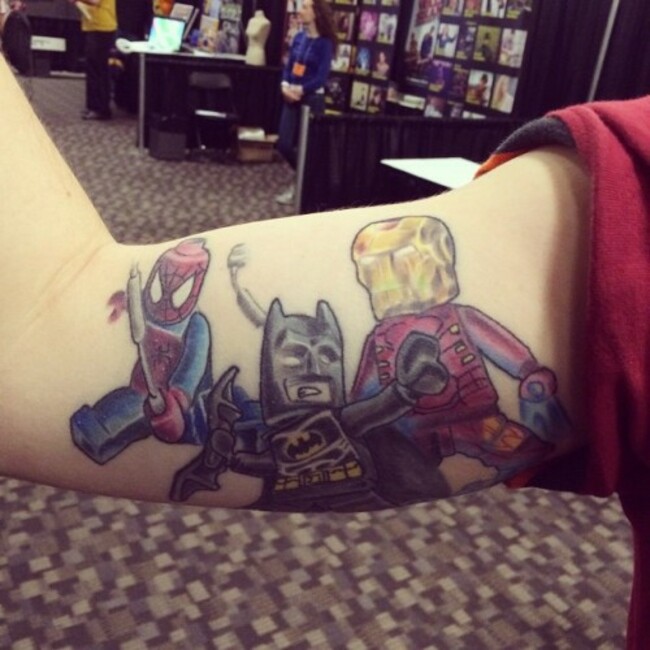 Dope bicep #tattoo I saw yesterday at #nacamam! #ironman #batman #spiderman #legos #legomovie