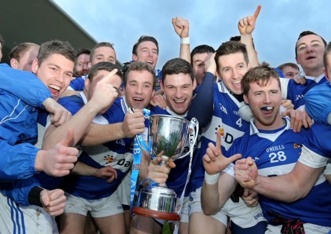 St Vincent's players celebrate with the cup