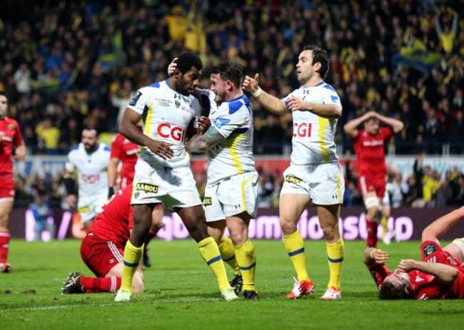 Noa Nakaitaci is congratulated after he scored a try by Thomas Domingo and Morgan Parra