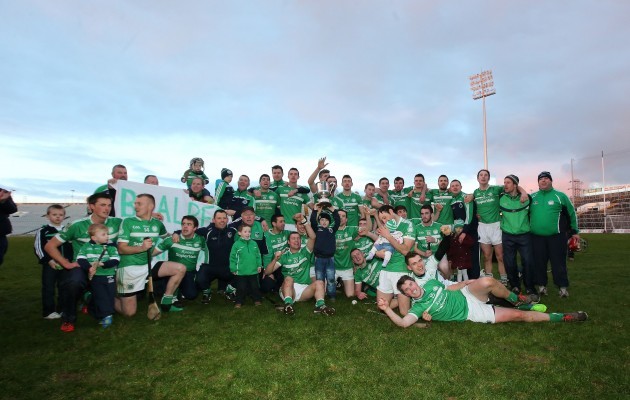 Kilmallock team celebrate with the trophy after the game