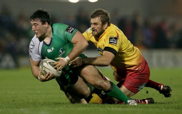 Denis Buckley tackled by Steven Shingler and Johan Snyman