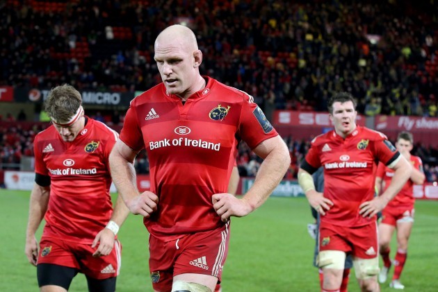 Paul O'Connell and the Munster players walk off the pitch dejected after the game