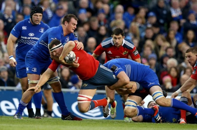 Robin Copeland tackled by Rhys Ruddock and Devin Toner