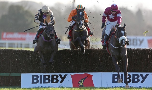 Don Cossack ridden by Brian O'Connell clears the last ahead of Boston Bob ridden by Ruby Walsh and Texas Jack ridden by Paul Carberry to win