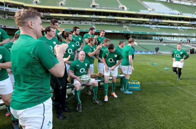 Brian O'Driscoll receives a round of applause from teammates as he arrives late for the team photograph