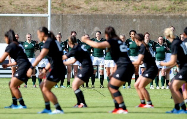 The Ireland players line up as the New Zealand players perform the Haka before