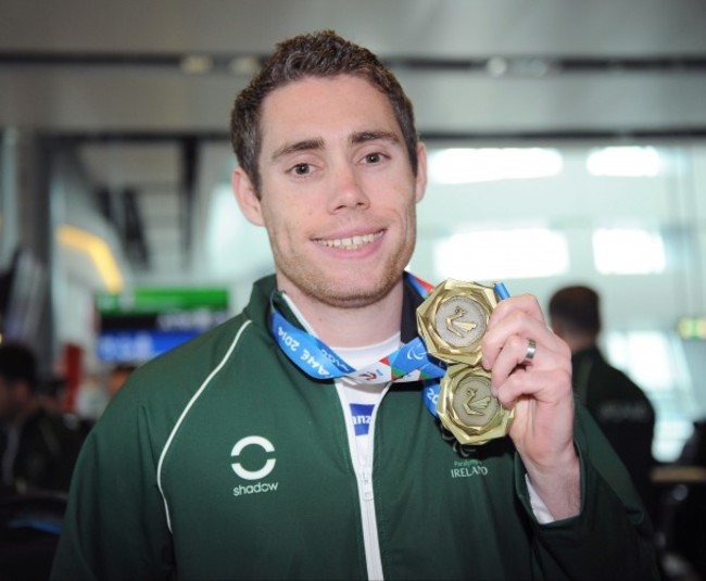 Jason Smyth displays his medal