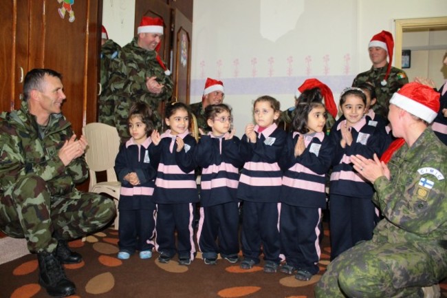 FINIRISHBATT troops visit a local orphanage in Tibnine as part of their Christmas celebrations.