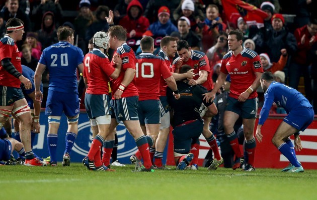 CJ Stander celebrates his try with Felix Jones and Andrew Conway