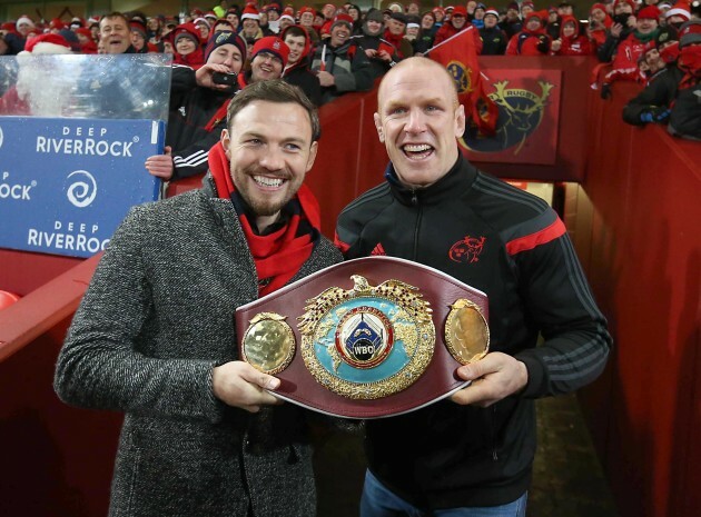 Andy Lee shows his belt off to the Munster fans at Halftime with Paul O'Connell