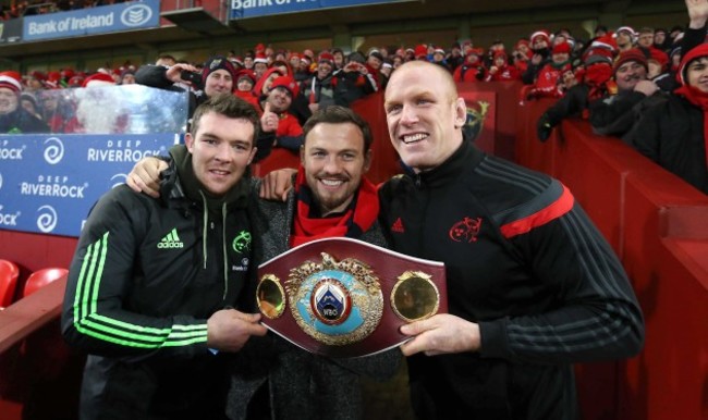 Andy Lee shows his belt off to the Munster fans at Halftime with Peter O'Mahony and Paul O'Connell