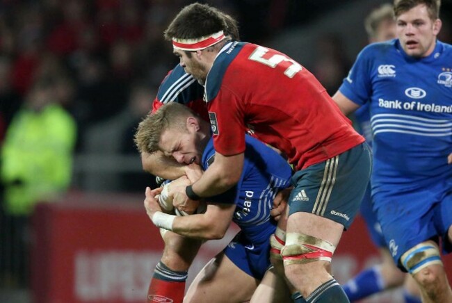 Ian Madigan is tackled by Billy Holland
