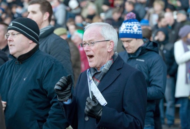 Racegoers cheer on the horses