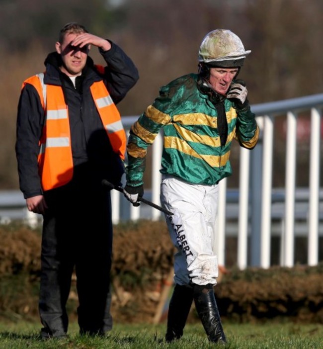 AP McCoy looks on after falling from Speckled Wood