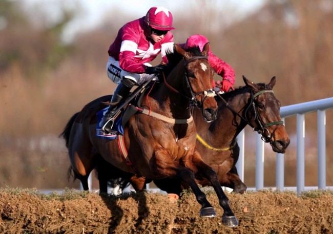 Identity Thief ridden by Bryan Cooper clears the last fence on his way to winning