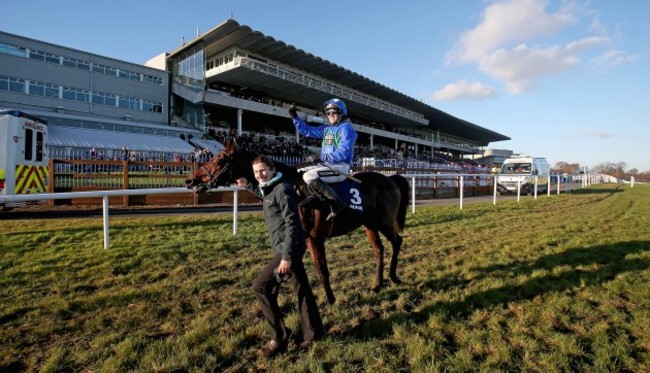 Ruby Walsh on Hurricane Fly pass the grand stand after winning