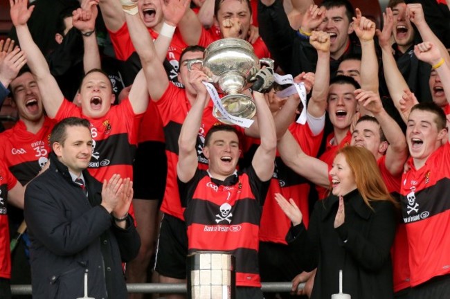 Darren McCarthy lifts the trophy