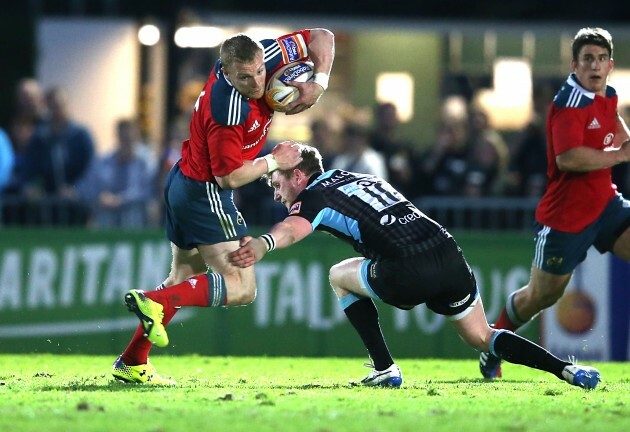 Keith Earls is tackled by Finn Russell