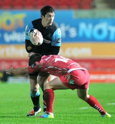 James Downey is tackled by Harry Robinson
