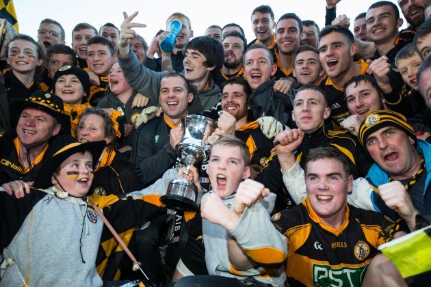 Austin Stacks players and supporters celebrate with the cup