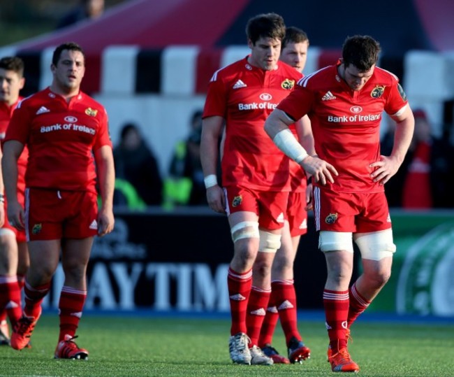 Peter O'Mahony leads his dejected players off the field