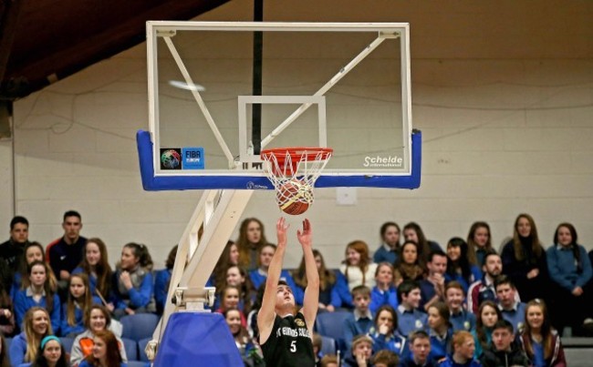 Mathais Traulsen etrieves the ball after it became lodged in the basket