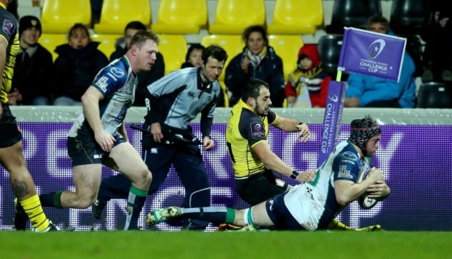 Eoin McKeon scores his side's second try despite Fabien Fortassin