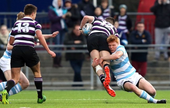 Cian Cooke is tackled by Gavin Mullen