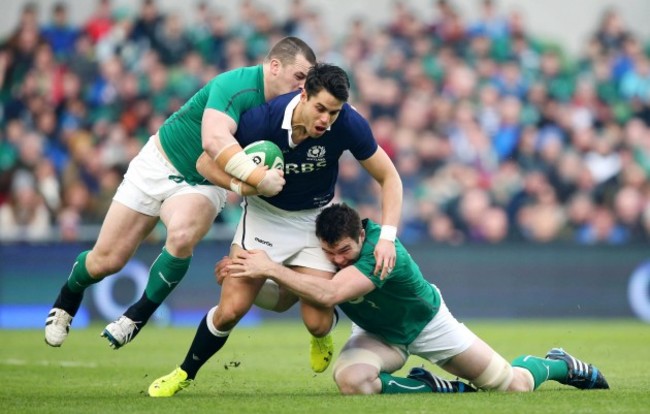 Sean Maitland is tackled by Cian Healy and Peter O'Mahony