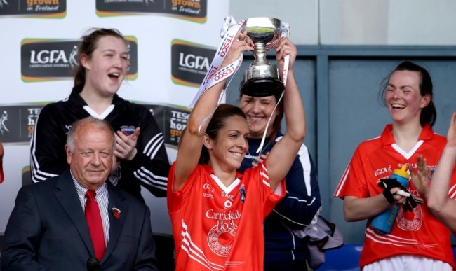 Caitlin Malone lifts the trophy