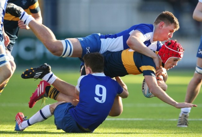 Paul McCullagh is tackled by James Black and Jonny Guy