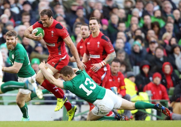Jamie Roberts breaks the tackle of Brian O'Driscoll