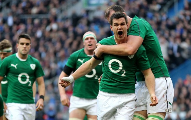 Jonathan Sexton celebrates with Devin Toner after he scored the opening try