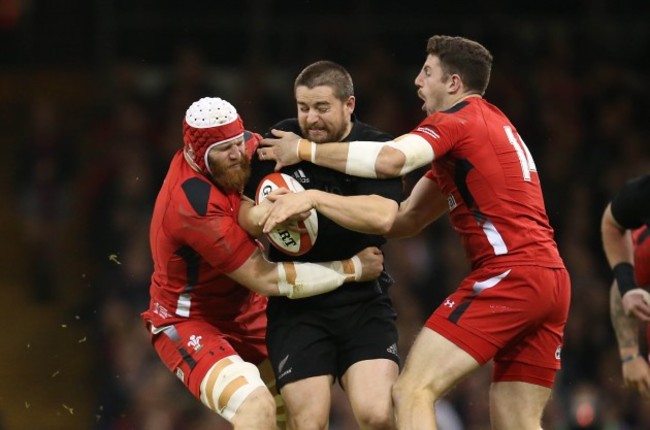 Dane Coles is tackled by Jake Ball and Alex Cuthbert