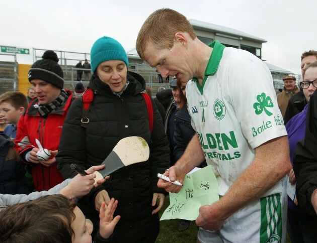 Henry Shefflin signs autographs for fans after the game