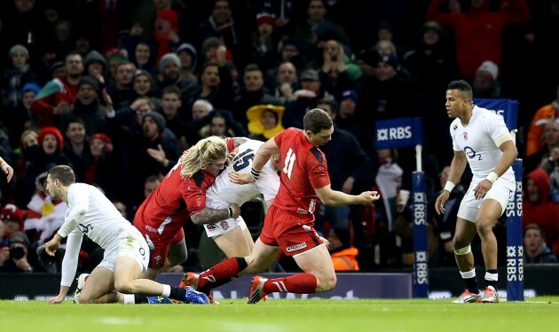 George North falls to the ground injured following a collision with Mike Brown