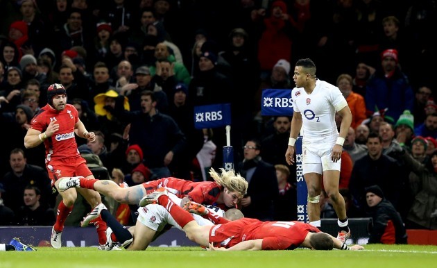 George North falls to the ground injured following a collision with Mike Brown