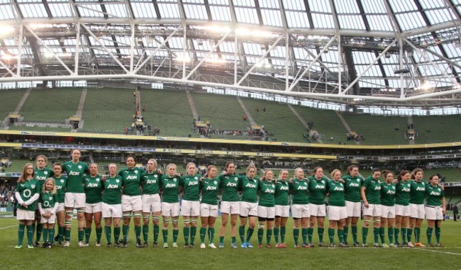 The women's team line up for the national anthem
