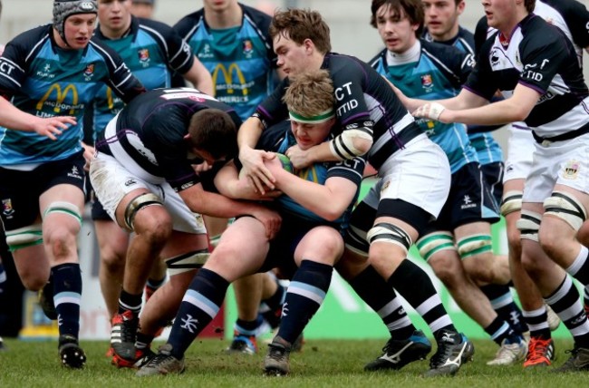 Brian O&rsquo;Mahony and Graham Smith tackle Conor Myers