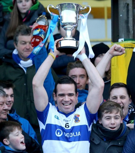 Ger Brennan lifts the trophy