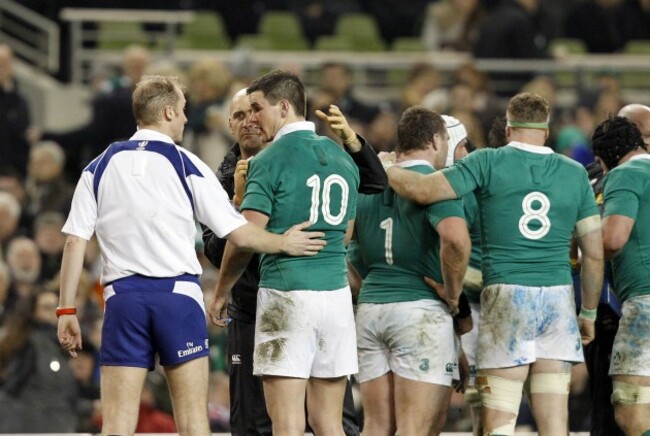 Wayne Barnes has a word with Johnny Sexton as he is treated for a head injury
